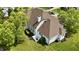 Picture of a home from above showing the roof, trees, landscaping and backyard space at 14020 Brookstone Dr, Carmel, IN 46032