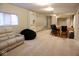 Finished basement featuring a bar with seating, open entertaining space, and a comfortable lounge chair at 14020 Brookstone Dr, Carmel, IN 46032