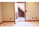 Finished basement showcasing a walk-out door with stairs to the exterior of the home at 14020 Brookstone Dr, Carmel, IN 46032