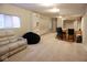 Finished basement featuring a bar with seating, open entertaining space, and a comfortable lounge chair at 14020 Brookstone Dr, Carmel, IN 46032