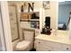 A clean bathroom features a shower with glass doors, a toilet, and a white vanity at 14020 Brookstone Dr, Carmel, IN 46032