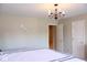 Calm bedroom with soft lighting and a ceiling chandelier at 14020 Brookstone Dr, Carmel, IN 46032