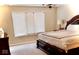 Bedroom featuring a large window with blinds and a dark wood bed at 14020 Brookstone Dr, Carmel, IN 46032
