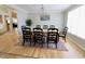 Bright formal dining room complete with chandelier, large window, and seating for eight at 14020 Brookstone Dr, Carmel, IN 46032
