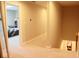 Hallway that shows a room and a small stairwell for storage at 14020 Brookstone Dr, Carmel, IN 46032