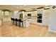 A spacious kitchen featuring modern appliances, granite countertops, and a large center island with seating at 14020 Brookstone Dr, Carmel, IN 46032