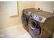 Close-up of modern laundry appliances in a well-lit and organized laundry room, showcasing convenience and efficiency at 14020 Brookstone Dr, Carmel, IN 46032