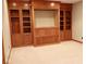 Living room showcasing custom built-in shelving for books and decorative storage options at 14020 Brookstone Dr, Carmel, IN 46032