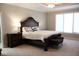 Elegant main bedroom with a grand bed, decorative accents, and large windows, creating a serene retreat at 14020 Brookstone Dr, Carmel, IN 46032