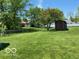 Large, well-maintained backyard with a storage shed and chain-link fence at 1425 Winding Trail Cir, Greenwood, IN 46142