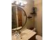 Bathroom showcasing large round mirror and accent shelving at 1425 Winding Trail Cir, Greenwood, IN 46142