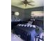 Cozy bedroom featuring a bed, a mirrored vanity, and landscape art at 1425 Winding Trail Cir, Greenwood, IN 46142
