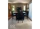 Cozy dining area features a stylish table set and natural light from the nearby windows at 1425 Winding Trail Cir, Greenwood, IN 46142