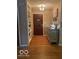 Inviting entryway boasts hardwood floors, built-in shelving, and decorative accents at 1425 Winding Trail Cir, Greenwood, IN 46142