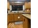 Traditional kitchen with warm wood cabinets, granite countertops, and modern appliances at 1425 Winding Trail Cir, Greenwood, IN 46142