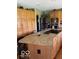 Well-equipped kitchen featuring a large island with seating, stainless steel appliances, and ample storage at 1425 Winding Trail Cir, Greenwood, IN 46142