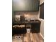 Well-organized laundry room with sink, cabinets, and convenient pull-out laundry baskets at 1425 Winding Trail Cir, Greenwood, IN 46142