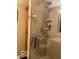 Updated shower featuring glass door and tiled walls at 1425 Winding Trail Cir, Greenwood, IN 46142