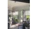 Cozy sunroom filled with natural light, wicker furniture, and potted plants creating a peaceful indoor-outdoor space at 1425 Winding Trail Cir, Greenwood, IN 46142