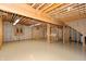 Unfinished basement with exposed beams and plenty of open space for customization at 1589 Belleflower Ct, Avon, IN 46123