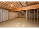Unfinished basement with exposed beams and plenty of open space for customization at 1589 Belleflower Ct, Avon, IN 46123