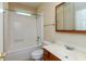 The bathroom boasts a combination tub and shower, wood-trimmed vanity, and is designed for practicality at 1589 Belleflower Ct, Avon, IN 46123