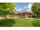 Beautiful brick home with well-manicured lawn and landscaping at 1589 Belleflower Ct, Avon, IN 46123