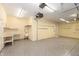 Spacious garage featuring epoxy floors, built in shelving, a work bench, and plenty of storage space at 1589 Belleflower Ct, Avon, IN 46123