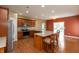 Spacious kitchen with wooden cabinets, stainless steel appliances, and a granite-top island at 1589 Belleflower Ct, Avon, IN 46123