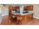 Open-concept kitchen with stainless steel appliances and spacious island with barstool seating at 1589 Belleflower Ct, Avon, IN 46123