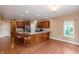 Open-concept kitchen with stainless steel appliances and spacious island with barstool seating at 1589 Belleflower Ct, Avon, IN 46123