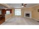 Bright living room with a fireplace and large windows, perfect for relaxing and entertaining at 1589 Belleflower Ct, Avon, IN 46123