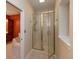 Bright bathroom featuring a glass shower, tile floors, and seamless access to the soaking tub for comfort at 1589 Belleflower Ct, Avon, IN 46123