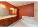 The luxurious main bathroom features double sinks, a large soaking tub, and generous storage spaces at 1589 Belleflower Ct, Avon, IN 46123