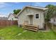 A fenced backyard with a small wood deck and green grass, creating a cozy outdoor space at 1606 Asbury St, Indianapolis, IN 46203