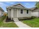 Charming home featuring fresh landscaping and a well-maintained yard at 1606 Asbury St, Indianapolis, IN 46203