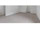 Bright room with neutral carpeting; clean, modern, and ready for personalization at 1606 Asbury St, Indianapolis, IN 46203