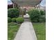 Charming backyard with a wooden pergola over a walkway, surrounded by lush greenery at 1711 Lafayette Ave # 7, Lebanon, IN 46052