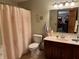 Bathroom featuring a vanity with a marble countertop, a toilet, and a bathtub with a decorative shower curtain at 1711 Lafayette Ave # 7, Lebanon, IN 46052