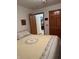 Bedroom with a large bed, offering a serene and comfortable space with view to the kitchen at 1711 Lafayette Ave # 7, Lebanon, IN 46052