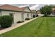Exterior view of condominium buildings with a well-maintained lawn and sidewalk in a quiet neighborhood at 1711 Lafayette Ave # 7, Lebanon, IN 46052