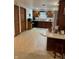 Functional kitchen with wooden cabinets, neutral countertops, and a peninsula offering additional seating at 1711 Lafayette Ave # 7, Lebanon, IN 46052