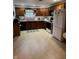 Well-lit kitchen with a full suite of appliances, wooden cabinets, and a clean, organized countertop space at 1711 Lafayette Ave # 7, Lebanon, IN 46052