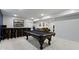 Finished basement with a billiard table, wet bar, and entertainment area at 17359 Wilkes Way, Westfield, IN 46074