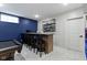 Finished basement with a wet bar with barstool seating, and recessed lighting at 17359 Wilkes Way, Westfield, IN 46074