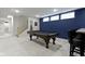 Spacious finished basement with a billiard table, stairs, and neutral carpet at 17359 Wilkes Way, Westfield, IN 46074