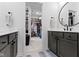 Dual vanities in bathroom with access to closet with custom shelving at 17359 Wilkes Way, Westfield, IN 46074