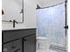 Stylish bathroom with a modern vanity and a shower featuring a marine-themed curtain, combining style and functionality at 17359 Wilkes Way, Westfield, IN 46074
