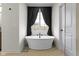 Elegant bathroom featuring a freestanding tub, dark fixtures, and a window at 17359 Wilkes Way, Westfield, IN 46074