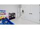 Well-lit bedroom featuring a race car bed, storage shelves, and ample floor space for play and activities at 17359 Wilkes Way, Westfield, IN 46074